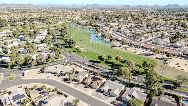 drone / aerial view featuring a water and mountain view