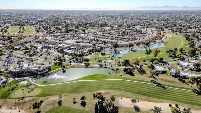 birds eye view of property with a water and mountain view