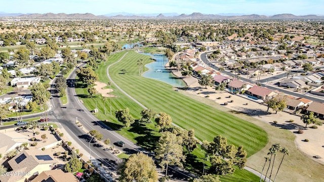 birds eye view of property with a water and mountain view