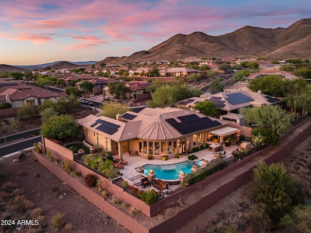 aerial view at dusk with a mountain view