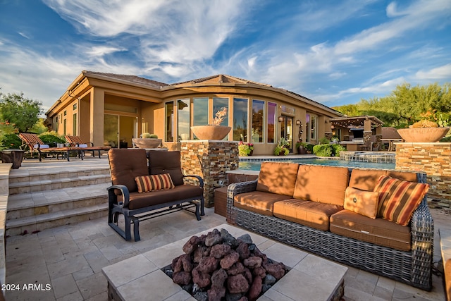 view of patio / terrace featuring a sunroom and an outdoor hangout area