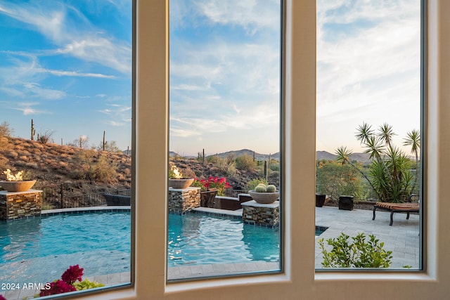 view of swimming pool featuring a mountain view and pool water feature