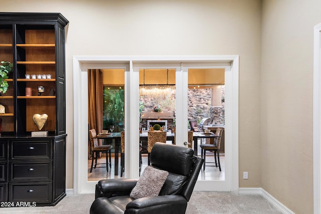 living area featuring carpet floors