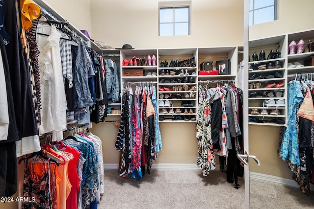 walk in closet featuring carpet