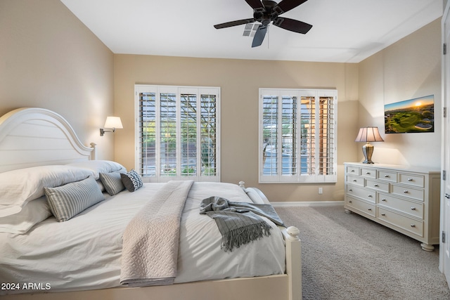 bedroom featuring ceiling fan and light colored carpet