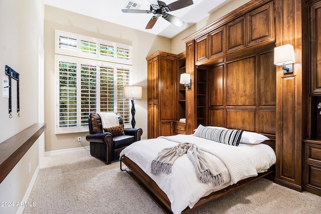 bedroom featuring light carpet and ceiling fan