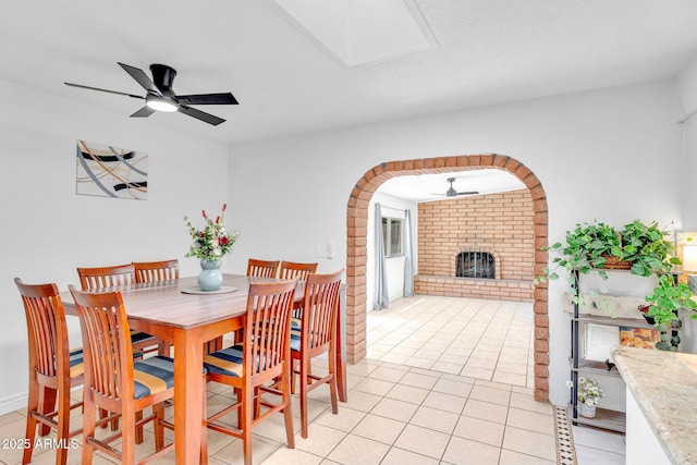 625 S Daley, Mesa, AZ 85204 - dining space with a ceiling fan, a brick fireplace, and light tile patterned flooring