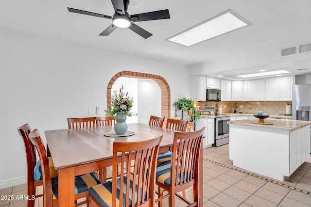 625 S Daley, Mesa, AZ 85204 - dining space with arched walkways, light tile patterned flooring, recessed lighting, and a ceiling fan
