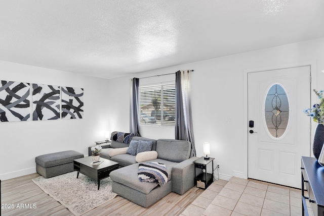 625 S Daley, Mesa, AZ 85204 - living area featuring a textured ceiling, baseboards, and light wood-style flooring
