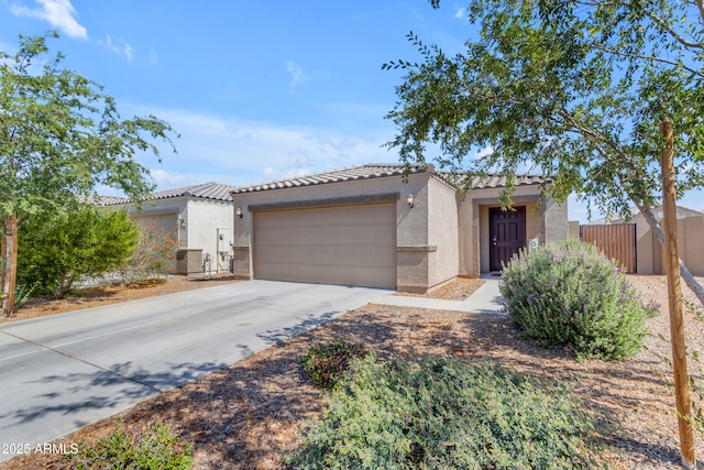 9442 E Silo Rd, Florence, AZ 85132 - view of front facade featuring stucco siding, a tile roof, a garage, and driveway