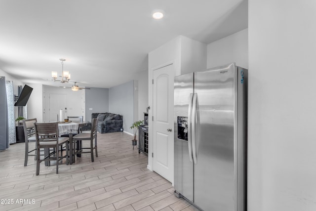 9442 E Silo Rd, Florence, AZ 85132 - dining area featuring a chandelier, light wood finished floors, and baseboards