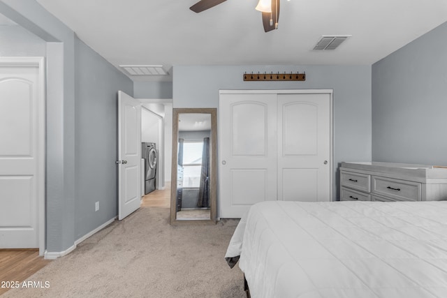 9442 E Silo Rd, Florence, AZ 85132 - bedroom with washer / clothes dryer, a closet, baseboards, light colored carpet, and a ceiling fan