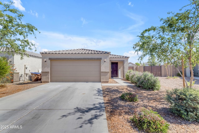 9442 E Silo Rd, Florence, AZ 85132 - view of front facade with a tiled roof, stucco siding, concrete driveway, and a garage