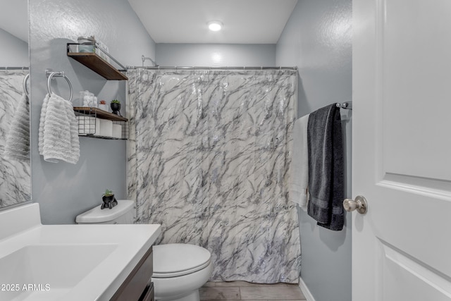 9442 E Silo Rd, Florence, AZ 85132 - full bath featuring vanity, toilet, wood finished floors, and a shower with curtain