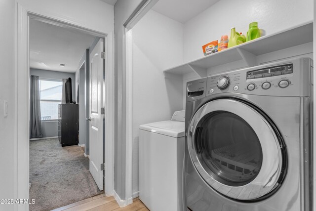 9442 E Silo Rd, Florence, AZ 85132 - washroom featuring washer and clothes dryer, baseboards, and light wood-type flooring