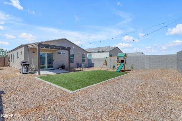 9442 E Silo Rd, Florence, AZ 85132 - rear view of property with stucco siding, a playground, and a patio