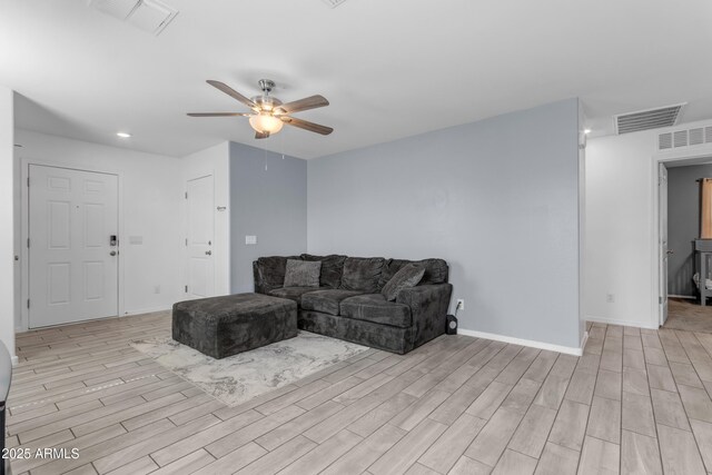 9442 E Silo Rd, Florence, AZ 85132 - living room with ceiling fan, light wood-type flooring, baseboards, and recessed lighting