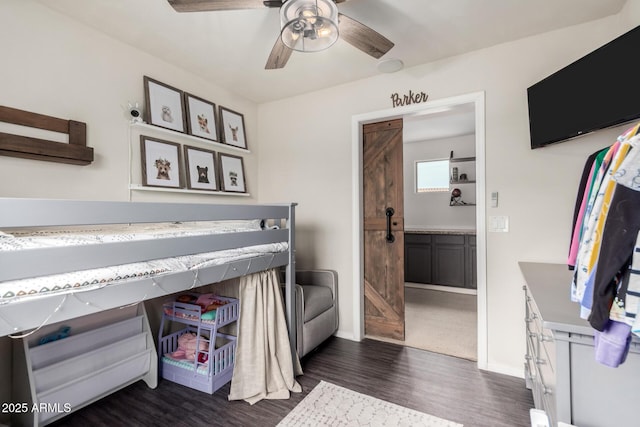 bedroom featuring dark wood-type flooring, ceiling fan, and baseboards