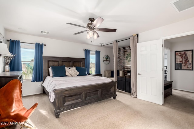 bedroom featuring light carpet, ceiling fan, and visible vents