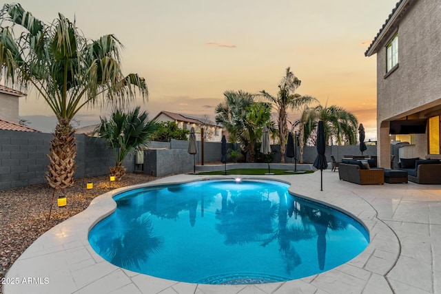 view of swimming pool featuring a fenced in pool, a patio area, a fenced backyard, and an outdoor hangout area