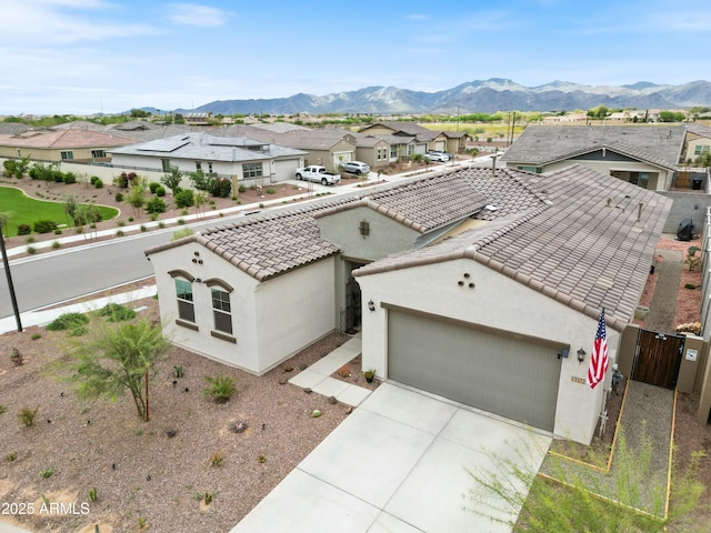 birds eye view of property featuring a mountain view