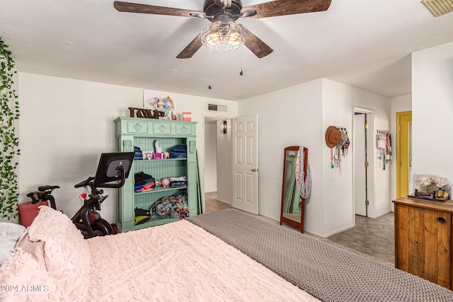 tiled bedroom featuring ceiling fan