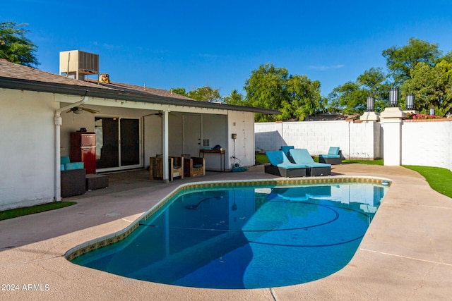 view of swimming pool with a patio area