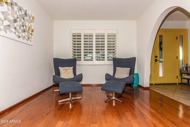 sitting room featuring wood-type flooring