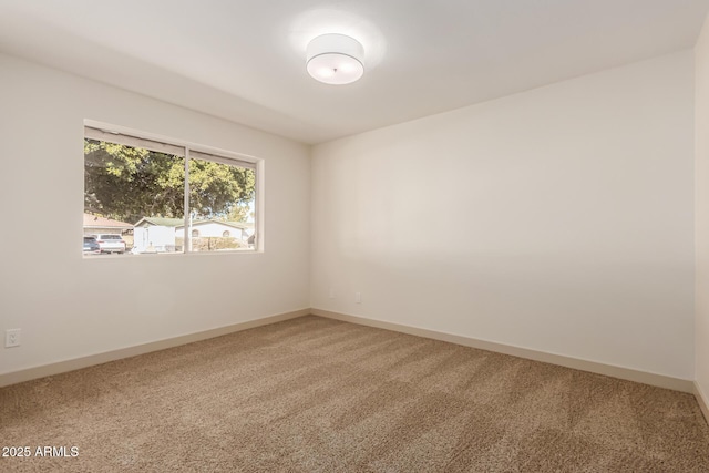 unfurnished room with carpet floors