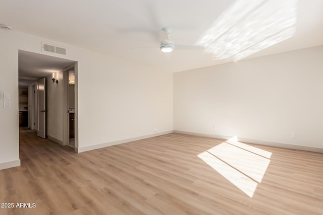 unfurnished room with ceiling fan and light hardwood / wood-style flooring