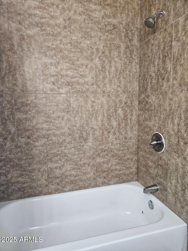 bathroom with shower / bath combination