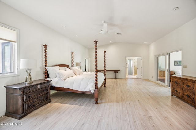 bedroom with ceiling fan, light hardwood / wood-style floors, and vaulted ceiling