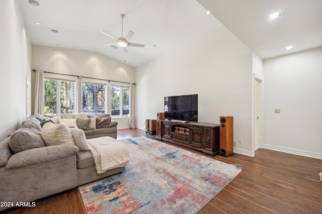 living room with dark hardwood / wood-style flooring, high vaulted ceiling, and ceiling fan