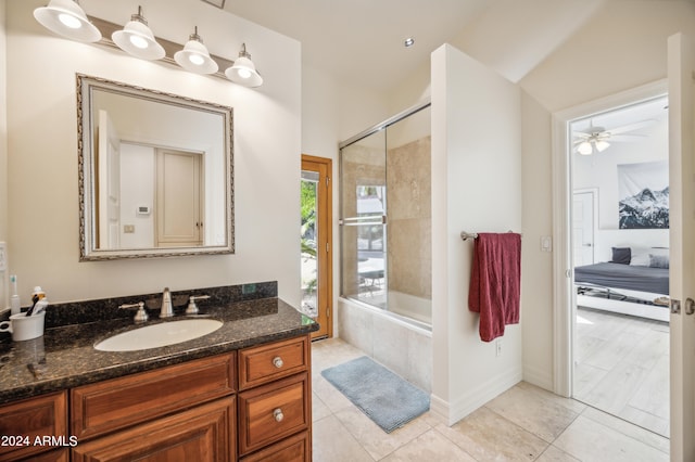 bathroom featuring tile patterned floors, ceiling fan, shower / bath combination with glass door, and vanity