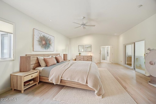 bedroom featuring ceiling fan, light wood-type flooring, and vaulted ceiling