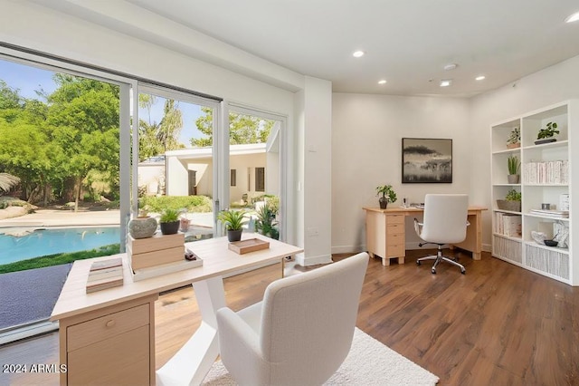 office space with dark wood-type flooring