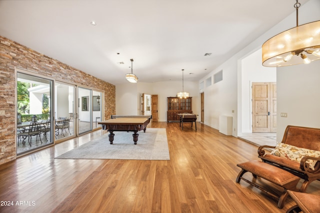 game room with billiards and light hardwood / wood-style flooring