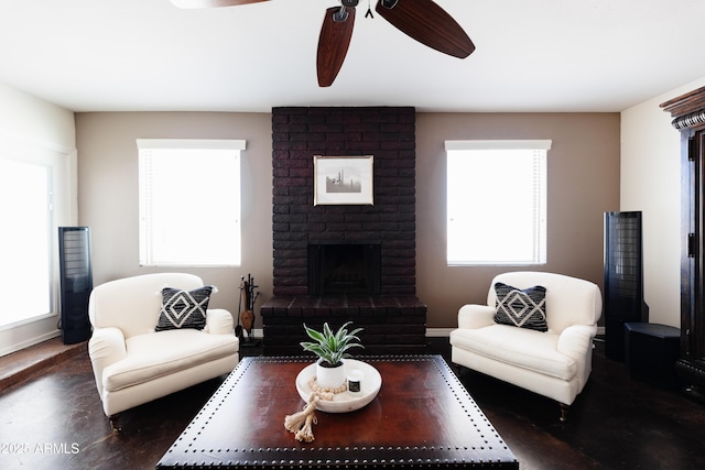 living room featuring a fireplace and ceiling fan