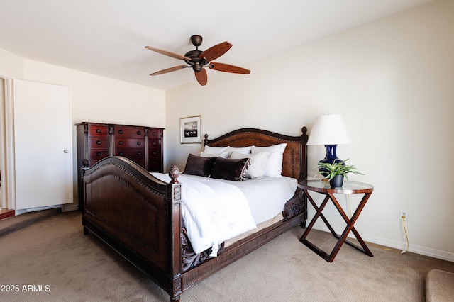 bedroom featuring light colored carpet and ceiling fan