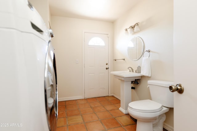 bathroom featuring tile patterned flooring and toilet