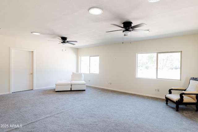 unfurnished room featuring carpet and ceiling fan