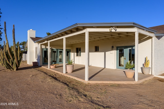 rear view of house with a patio