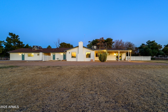 single story home featuring cooling unit