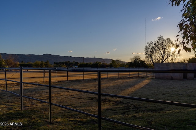 exterior space featuring a rural view and a mountain view