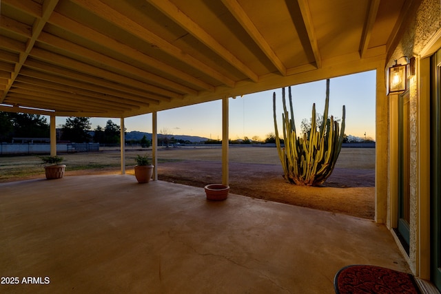 view of patio terrace at dusk