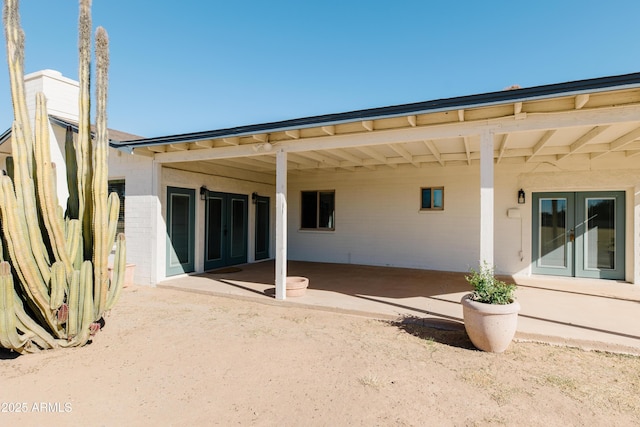 back of property featuring a patio area