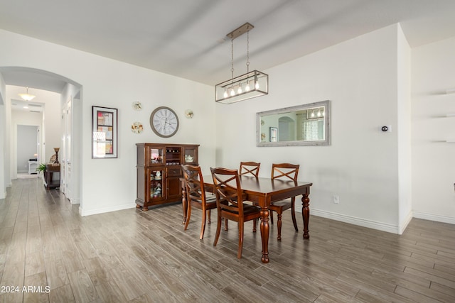 dining space featuring dark hardwood / wood-style floors