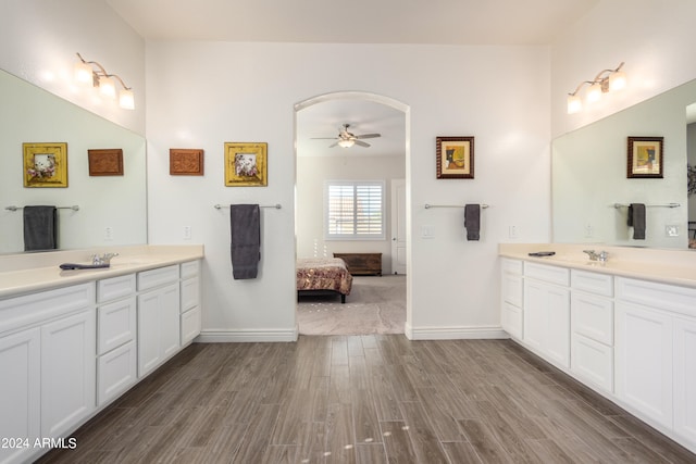 bathroom featuring vanity, wood-type flooring, and ceiling fan