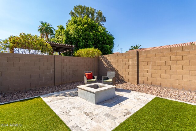 view of patio / terrace featuring a fire pit, exterior kitchen, and area for grilling