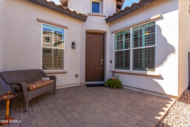 property entrance with a patio